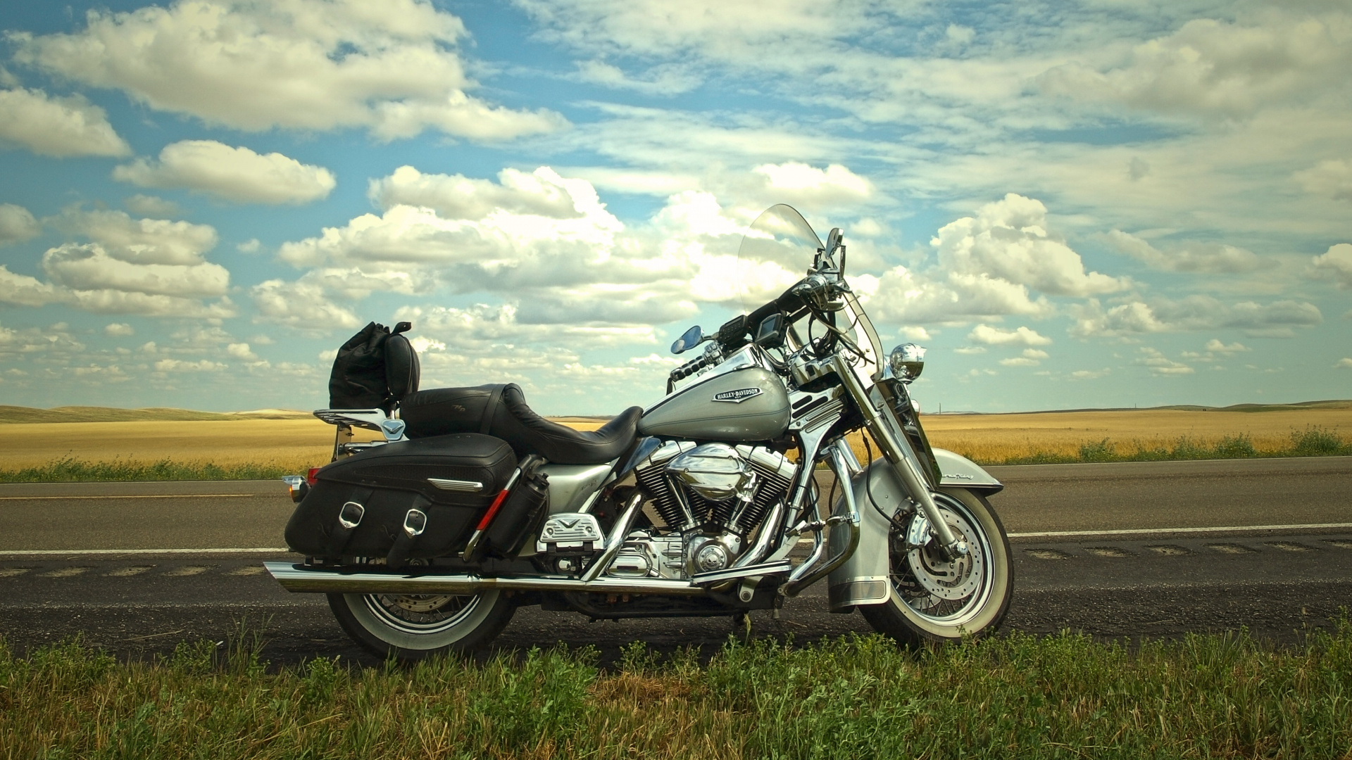 Black and White Sports Bike on Brown Field Under White Clouds and Blue Sky During Daytime. Wallpaper in 1920x1080 Resolution