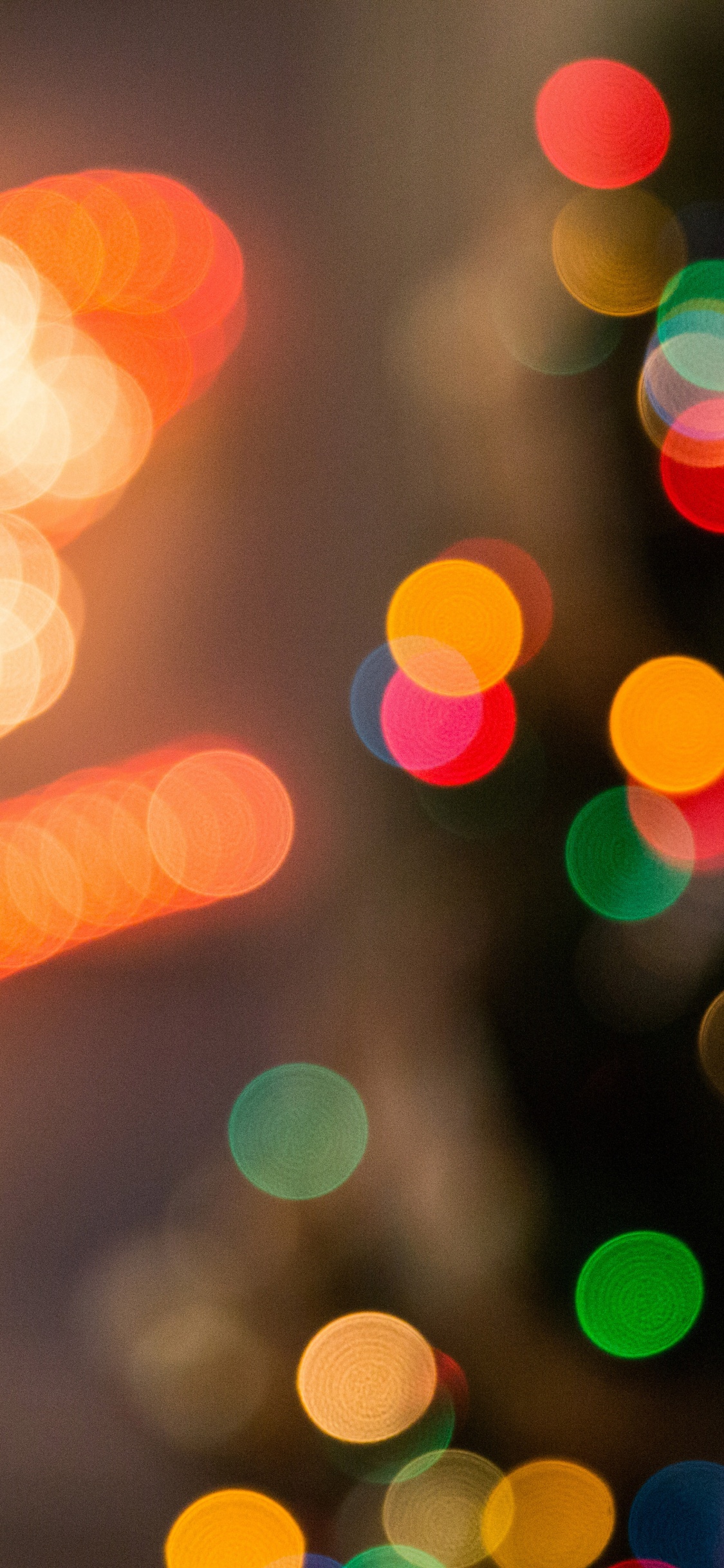 Orange Und Gelbe Bokeh-Lichter. Wallpaper in 1125x2436 Resolution