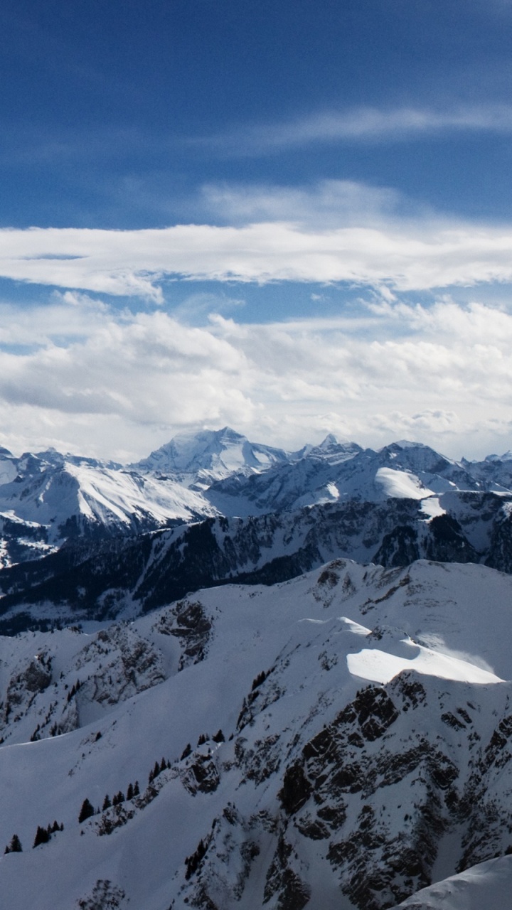 Snow Covered Mountain Under Blue Sky During Daytime. Wallpaper in 720x1280 Resolution