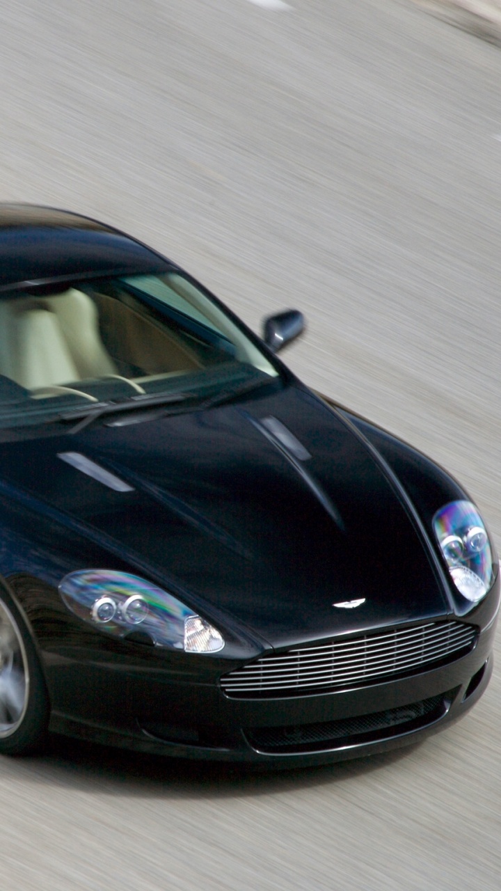 Porsche 911 Noire Sur Route. Wallpaper in 720x1280 Resolution