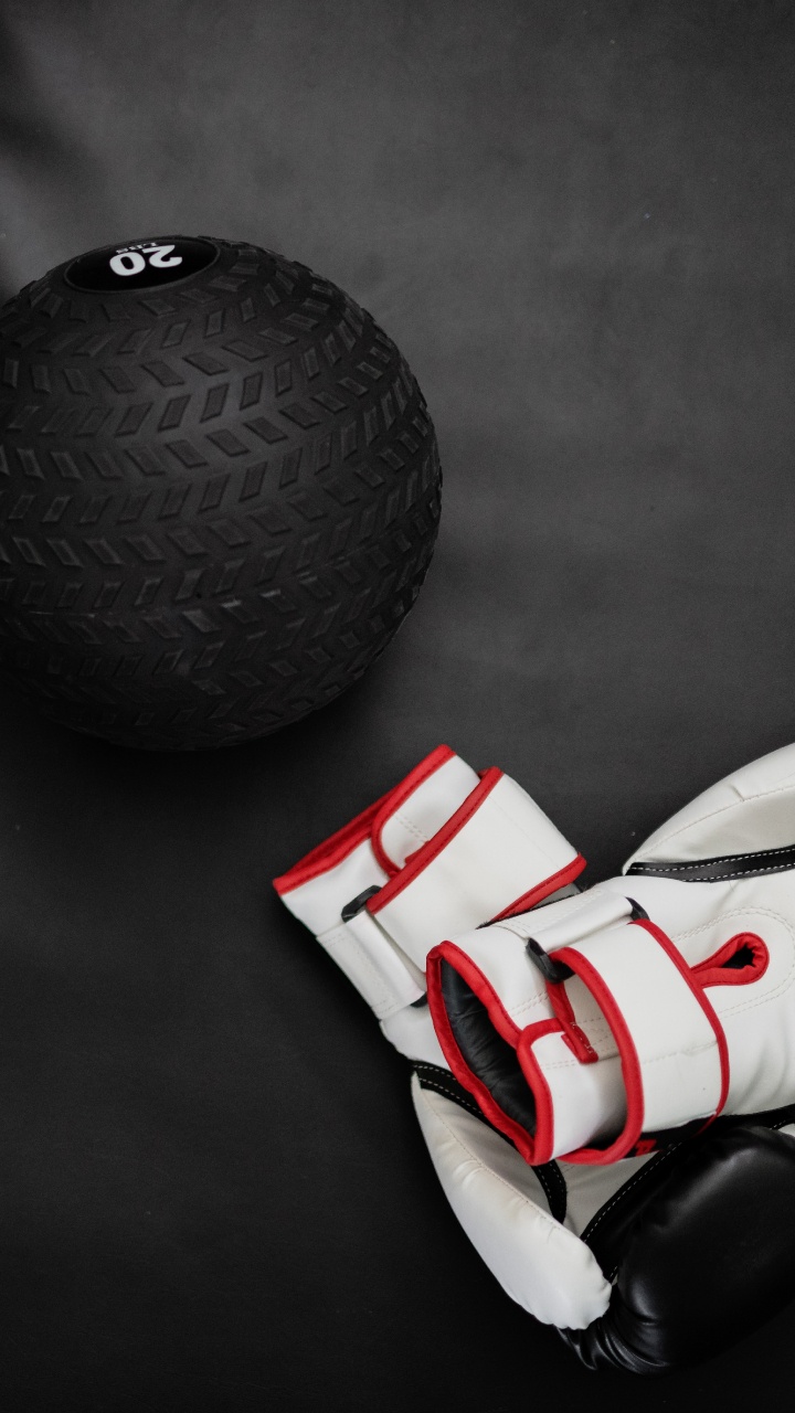 White and Red Soccer Ball Beside Black Ball. Wallpaper in 720x1280 Resolution