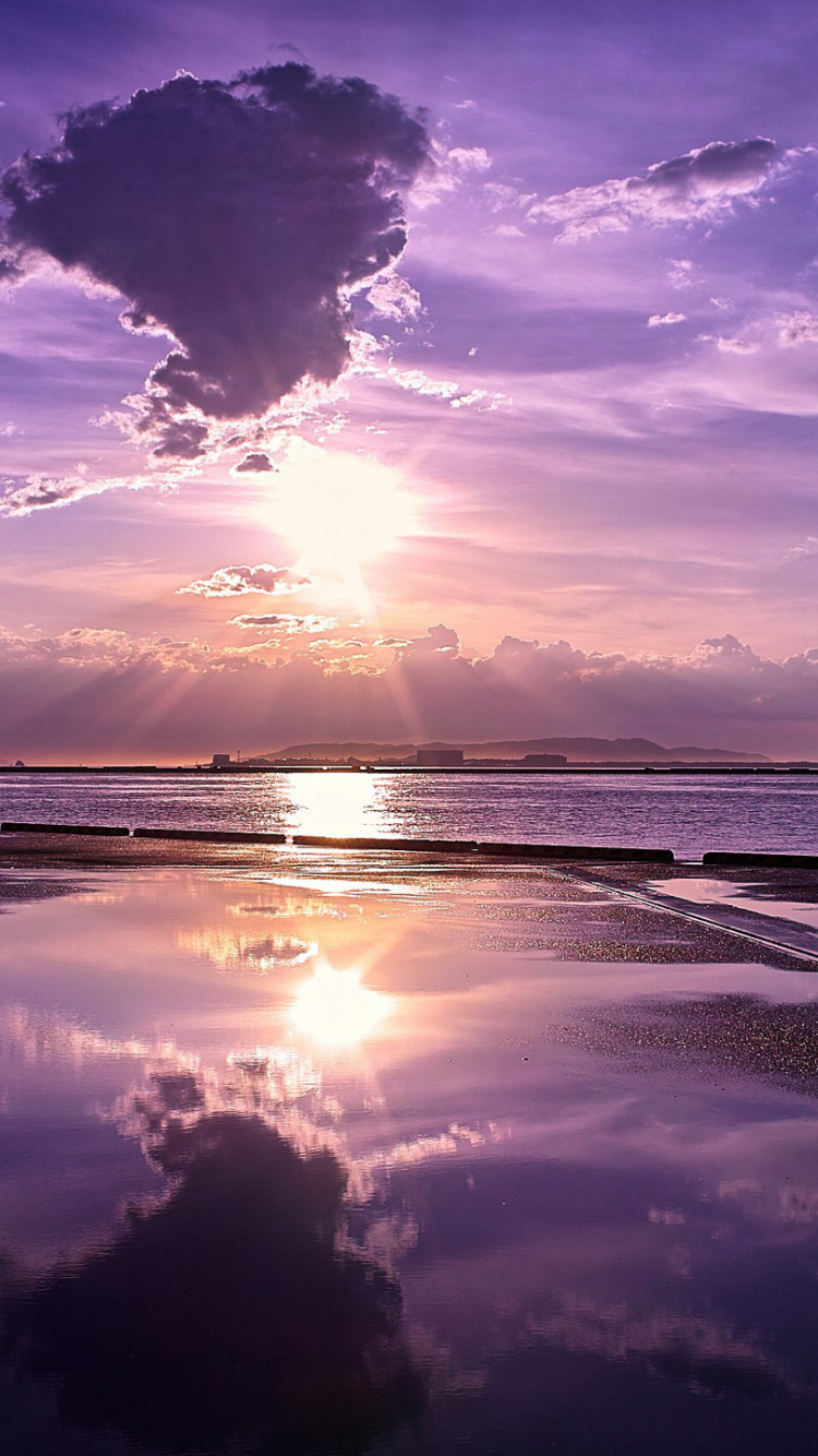Body of Water Under Blue Sky During Sunset. Wallpaper in 750x1334 Resolution