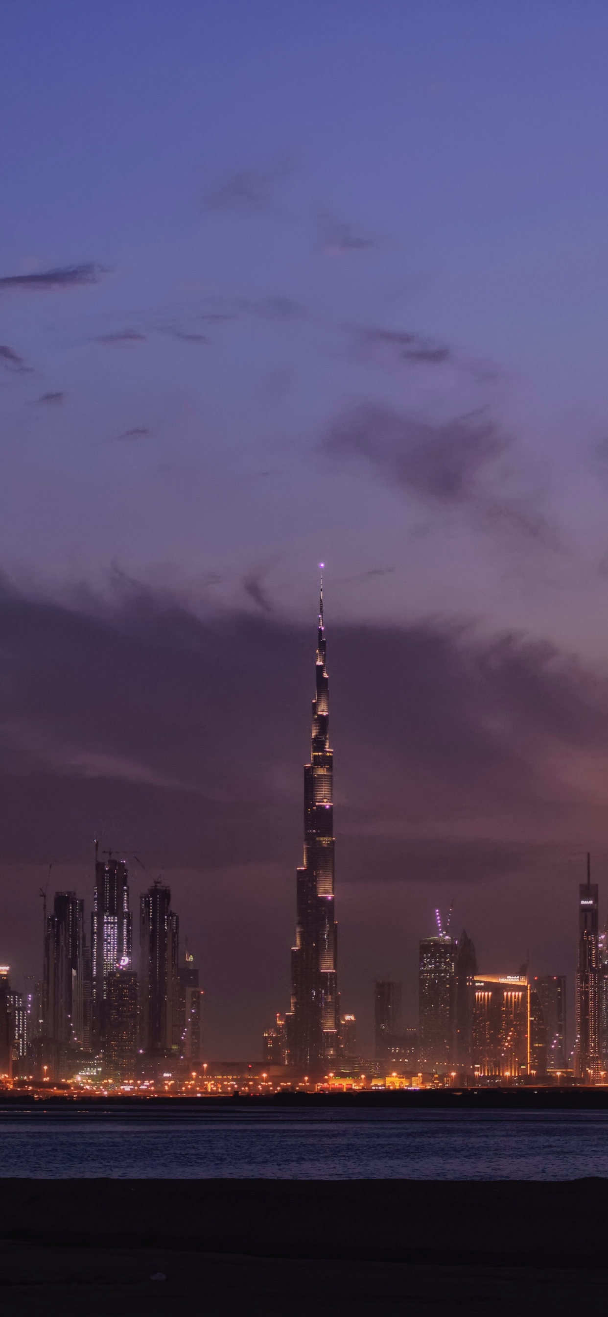 City Skyline During Night Time. Wallpaper in 1242x2688 Resolution