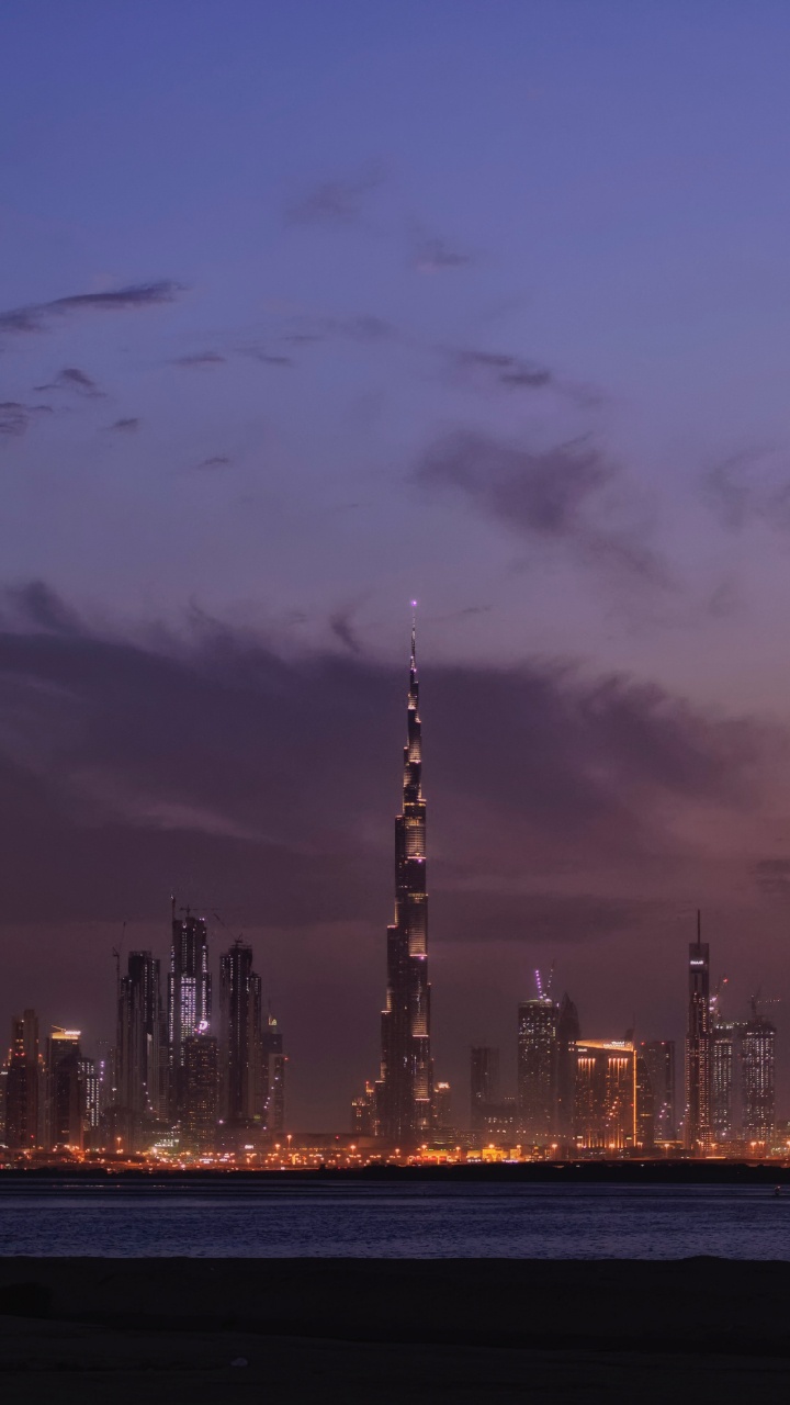 City Skyline During Night Time. Wallpaper in 720x1280 Resolution