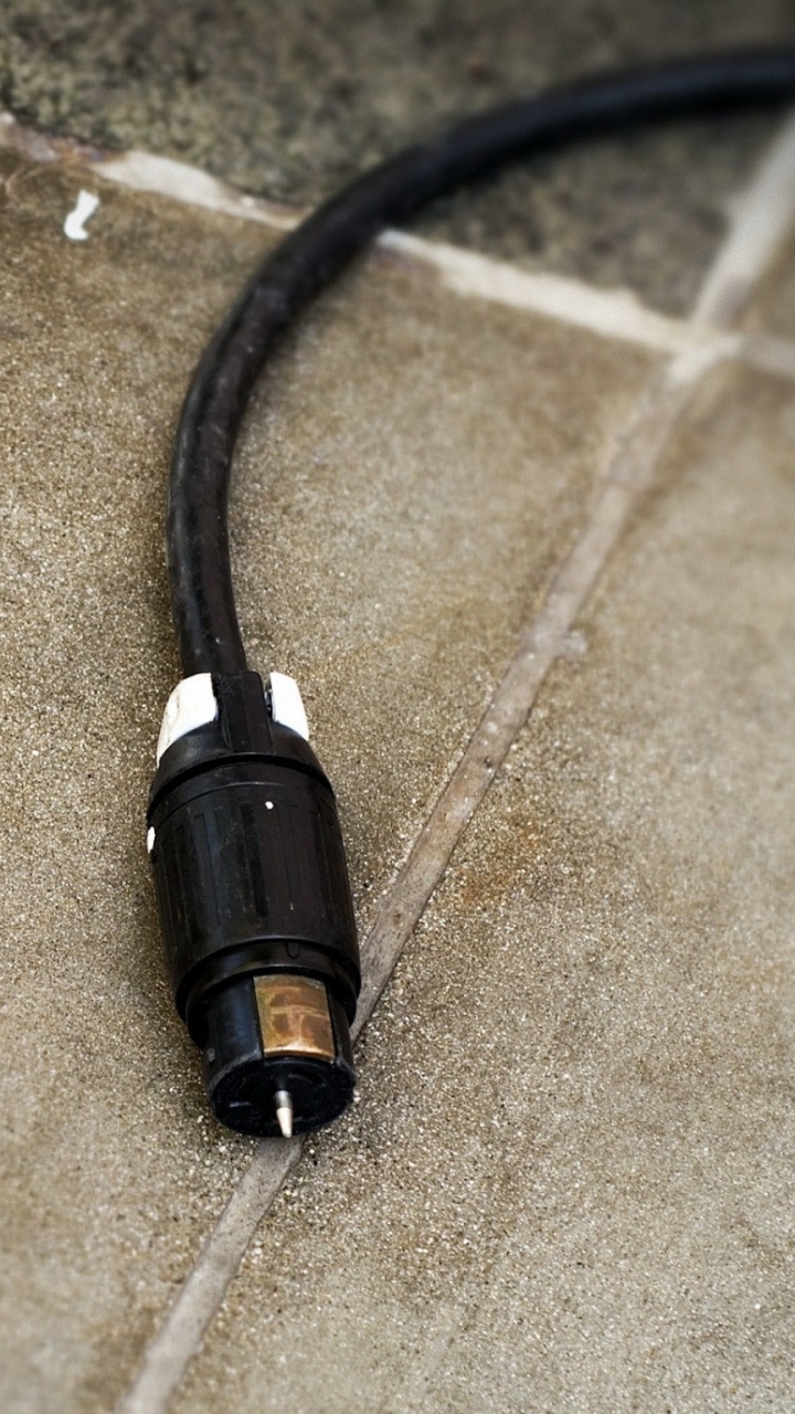 Black Audio Jack on Brown Textile. Wallpaper in 720x1280 Resolution