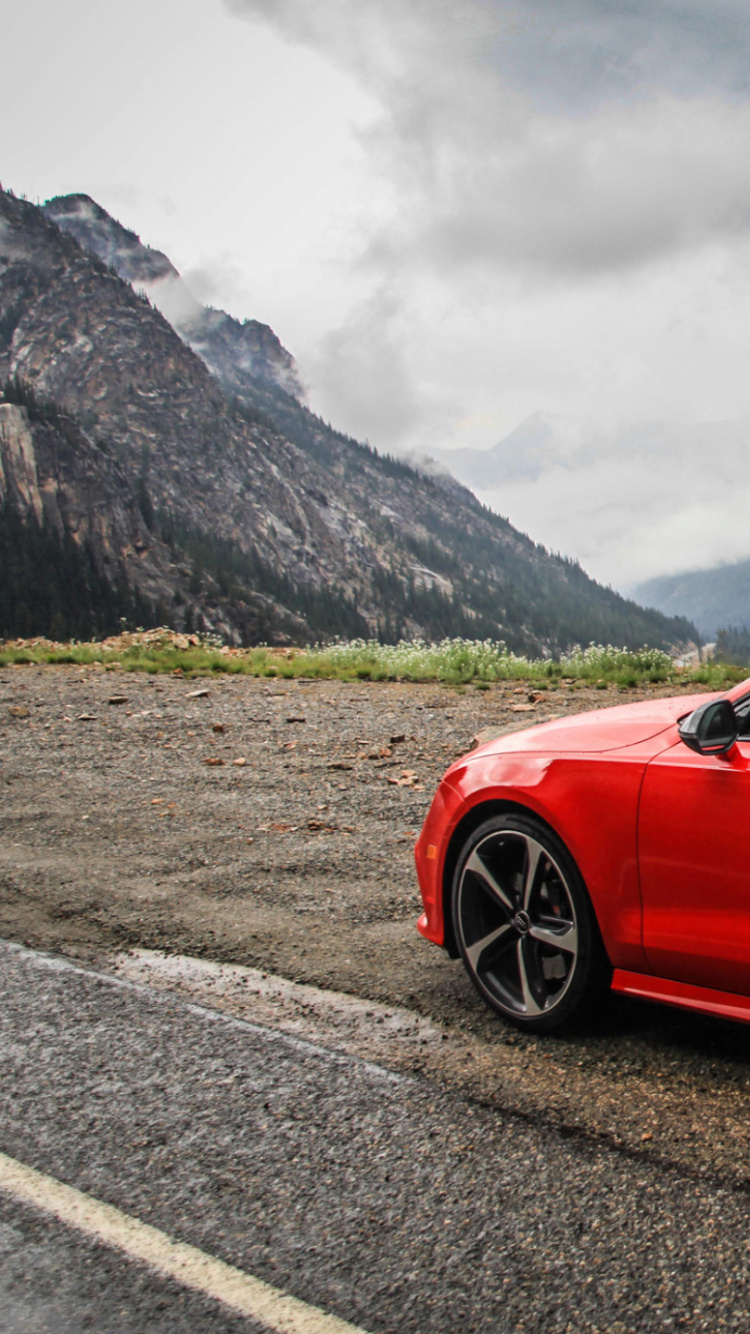 Red Sedan on Black Soil Near Green Grass Field During Daytime. Wallpaper in 750x1334 Resolution