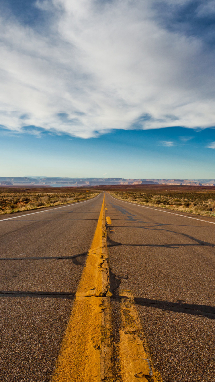 Gray Asphalt Road Under Blue Sky During Daytime. Wallpaper in 750x1334 Resolution