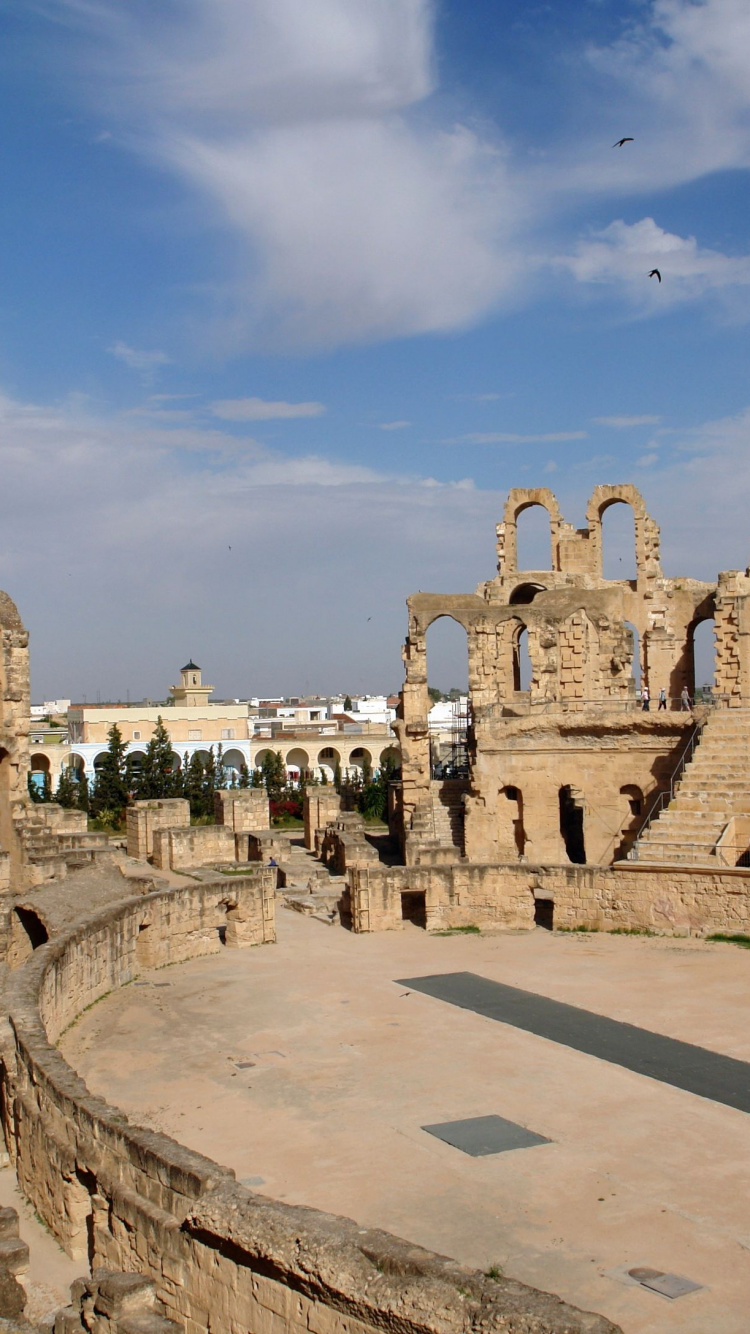Edificio de Hormigón Marrón Bajo un Cielo Azul Durante el Día. Wallpaper in 750x1334 Resolution