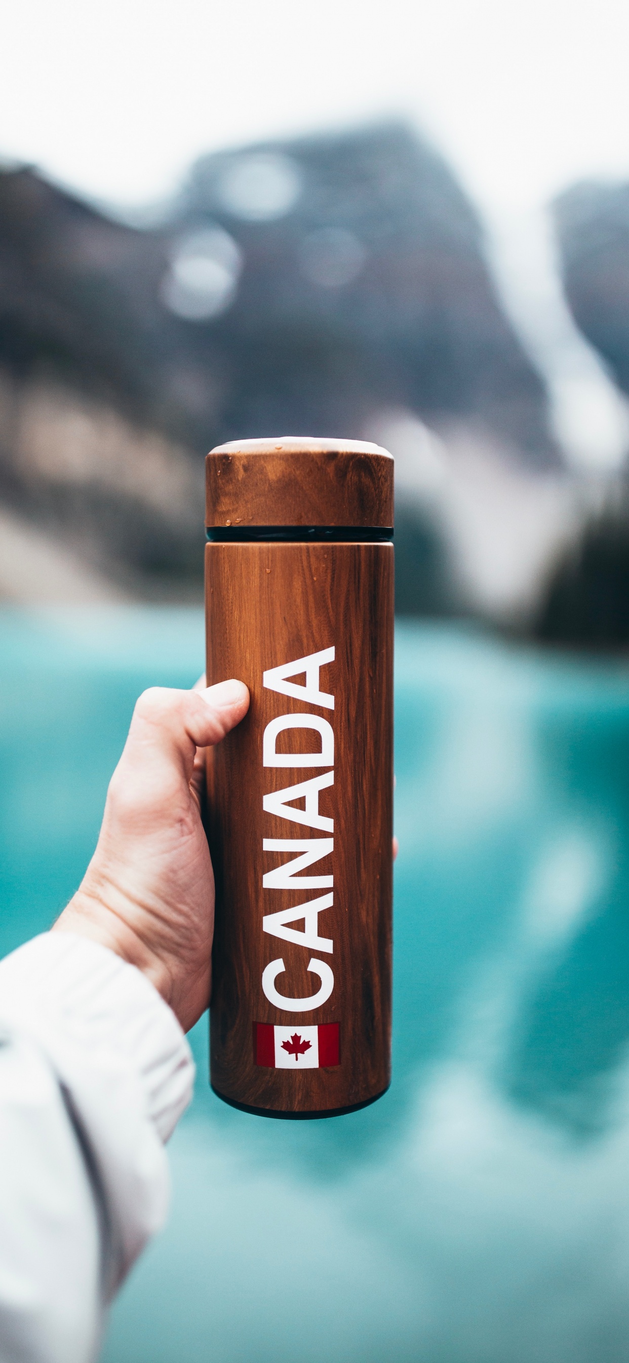 Person Holding Brown Wooden Bar. Wallpaper in 1242x2688 Resolution