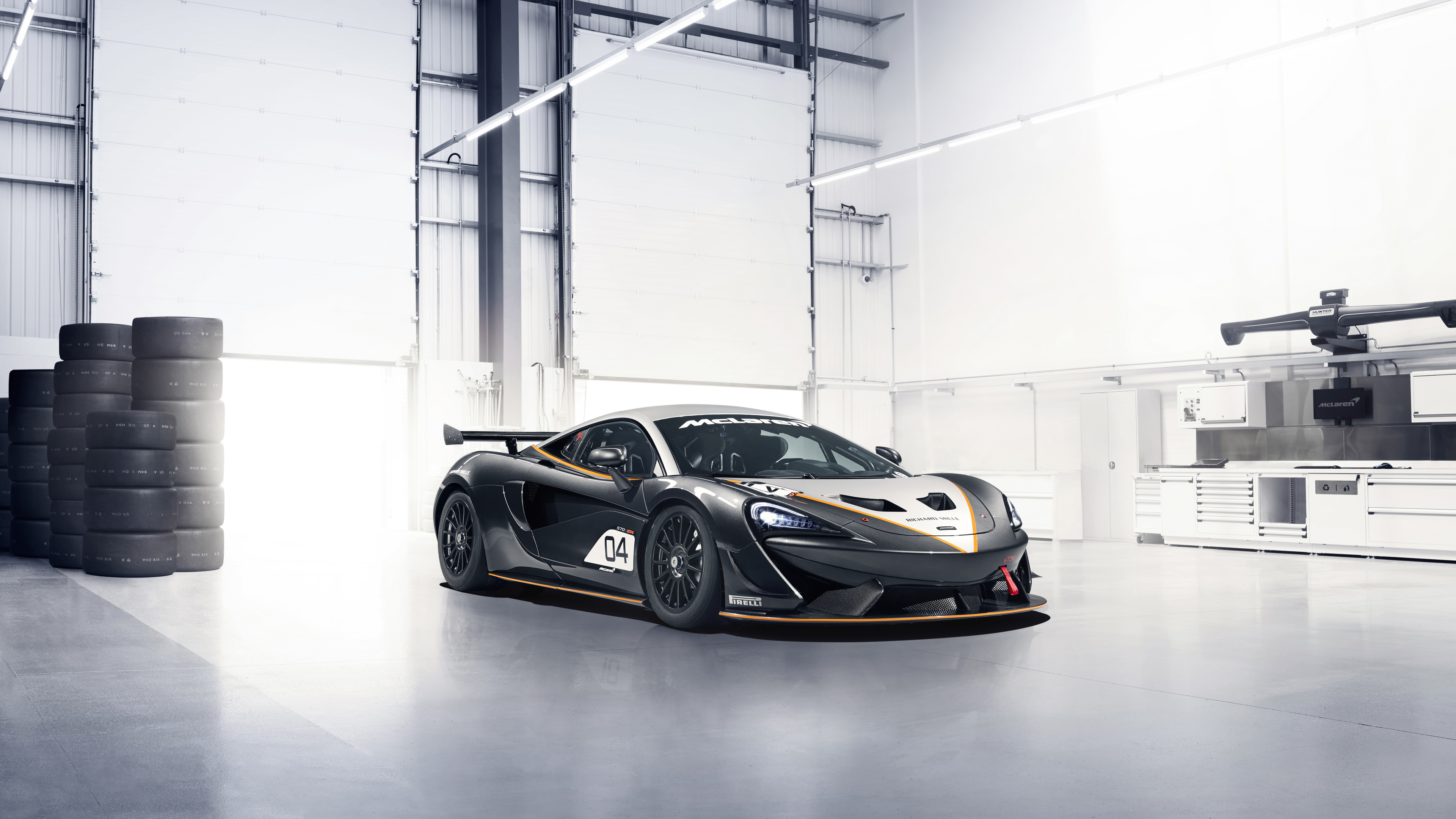 Black and White Porsche 911 Parked in a Garage. Wallpaper in 3840x2160 Resolution