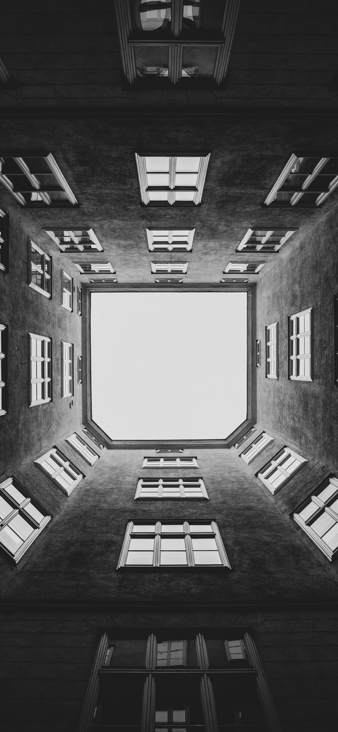 Grayscale Photo of Building Interior. Wallpaper in 1125x2436 Resolution