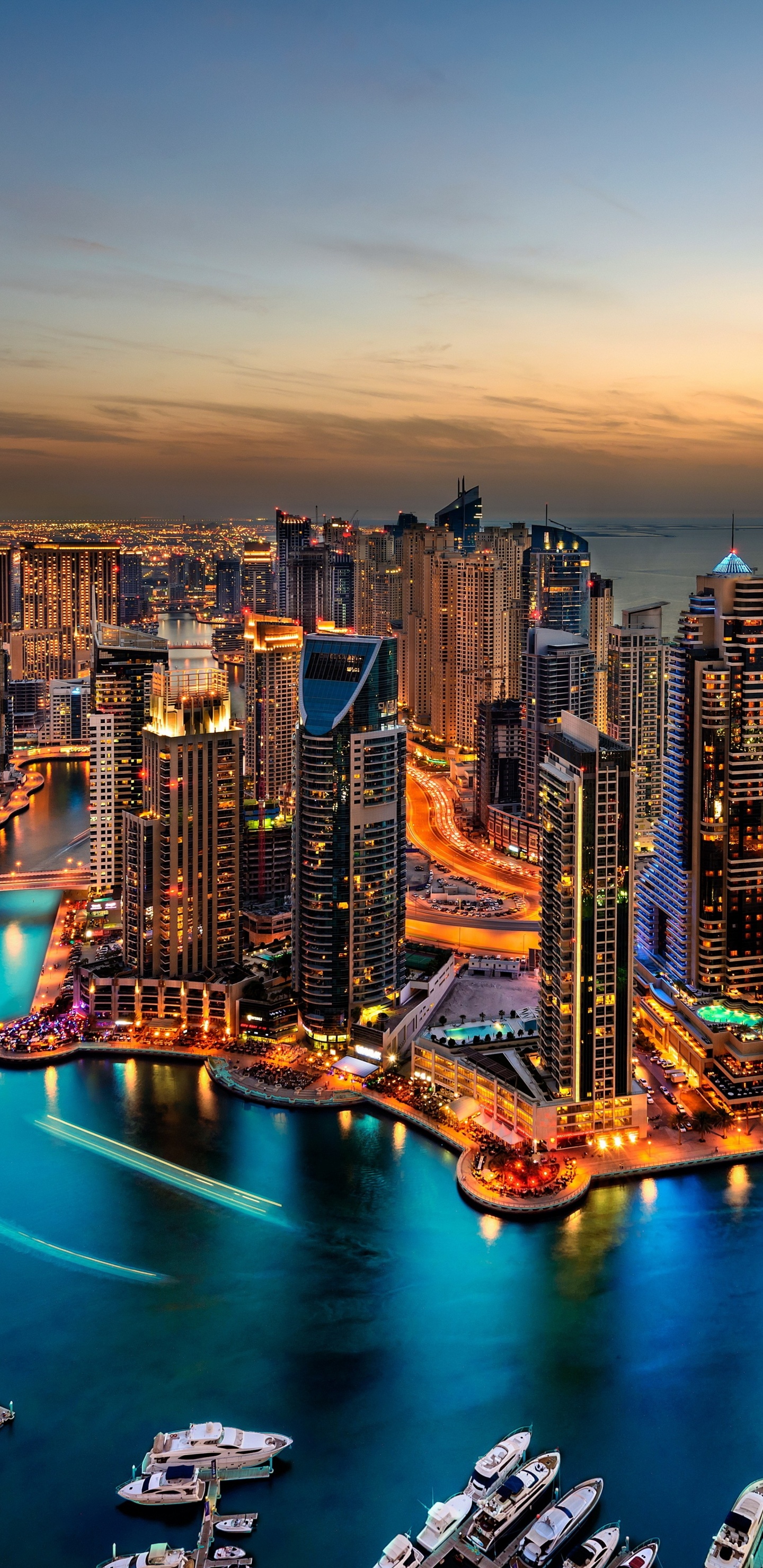 High Rise Buildings Near Body of Water During Night Time. Wallpaper in 1440x2960 Resolution