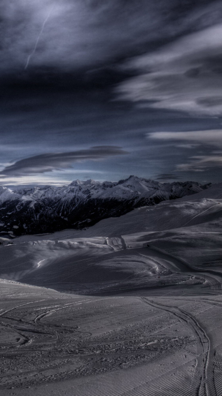 Snow Covered Mountain Under Blue Sky. Wallpaper in 750x1334 Resolution