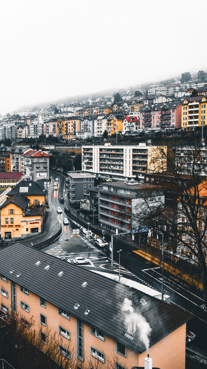 Brown and White Concrete Buildings During Daytime. Wallpaper in 720x1280 Resolution
