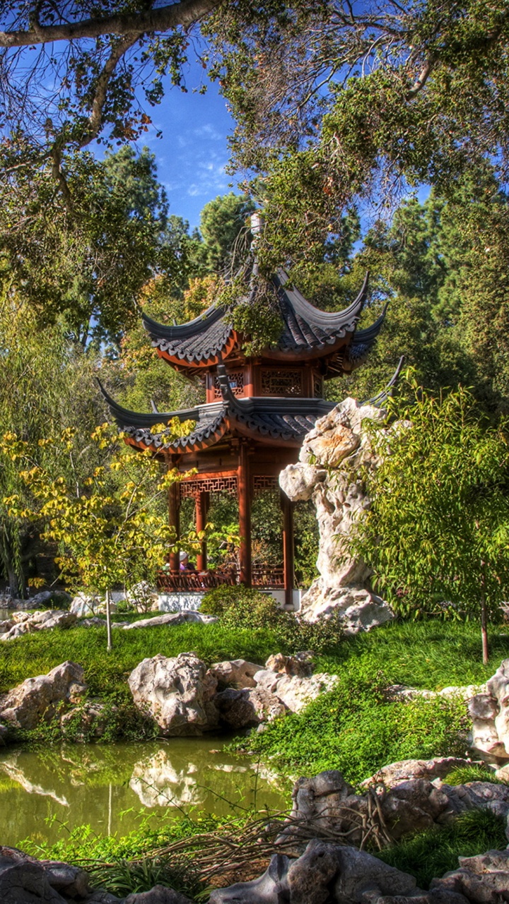 Brown and Black Temple Surrounded by Green Trees During Daytime. Wallpaper in 720x1280 Resolution