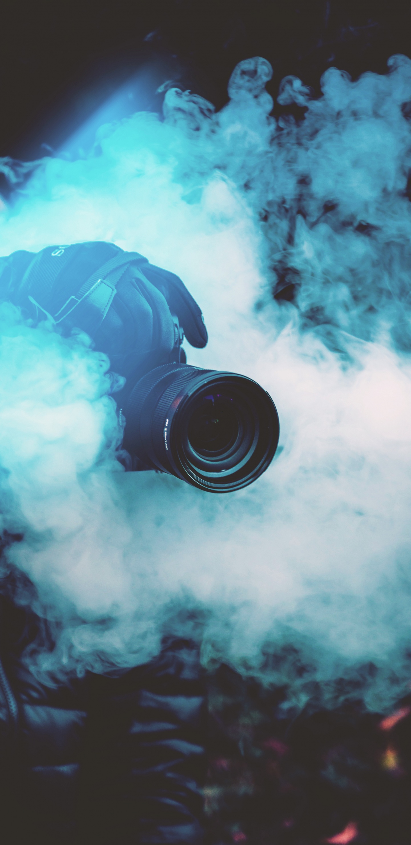 Black Dslr Camera on Blue Smoke. Wallpaper in 1440x2960 Resolution