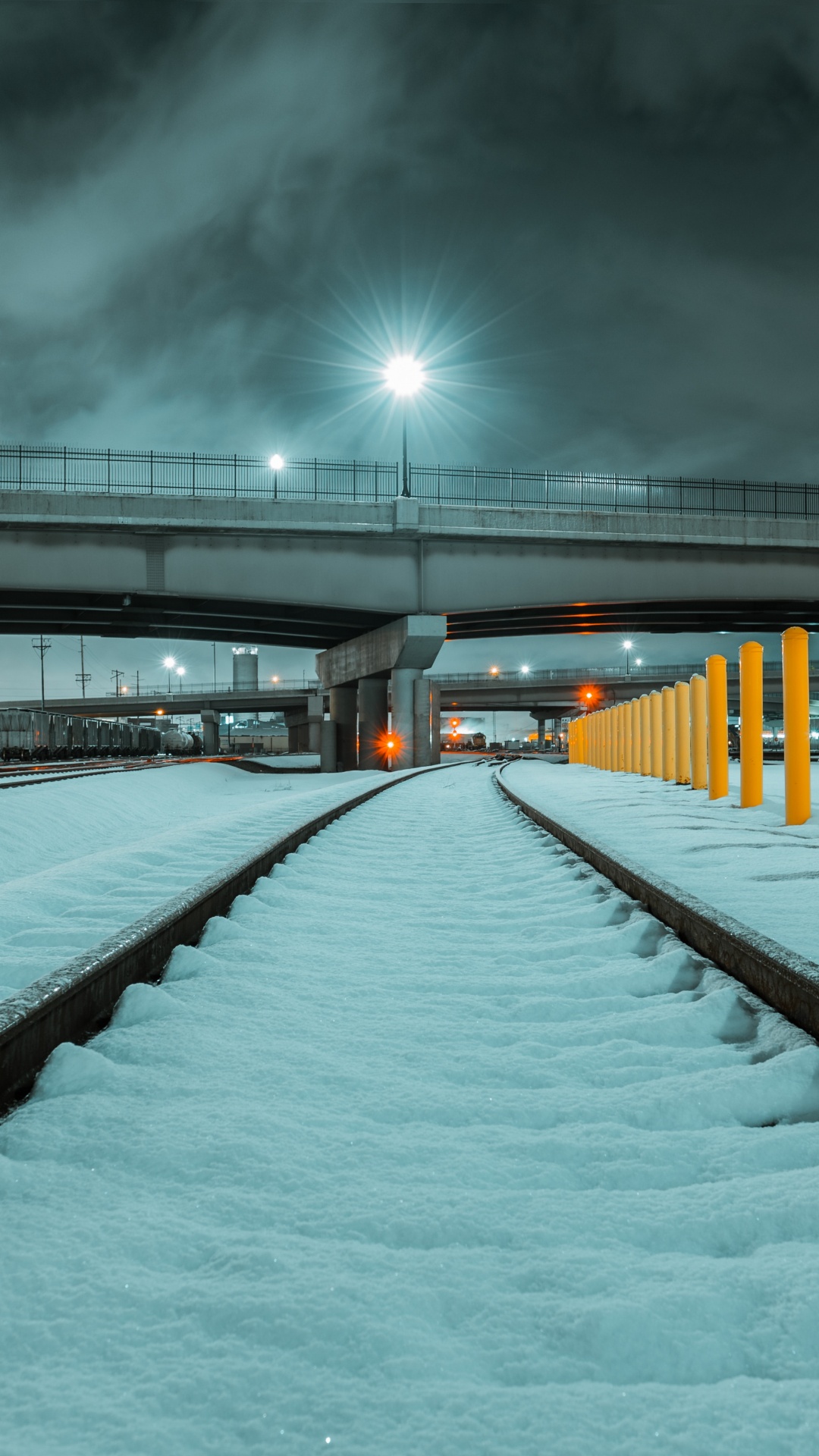 Snow Covered Bridge During Night Time. Wallpaper in 1080x1920 Resolution