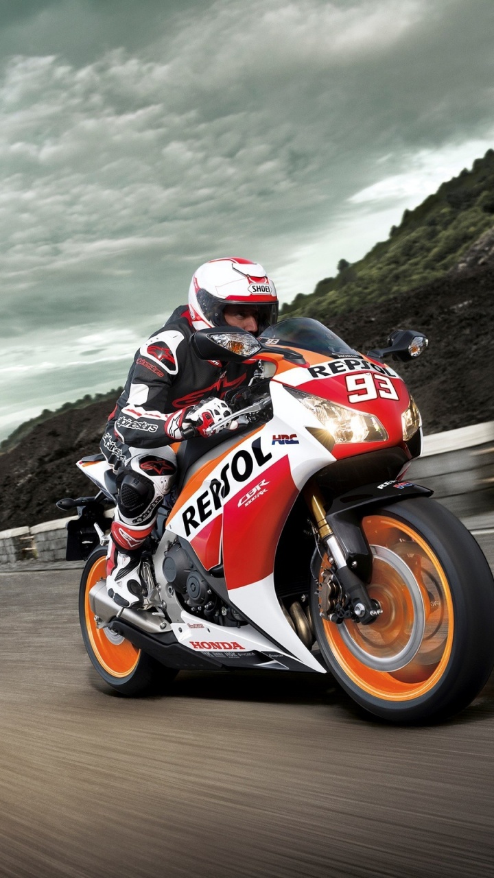 Man Riding on Orange Sports Bike. Wallpaper in 720x1280 Resolution