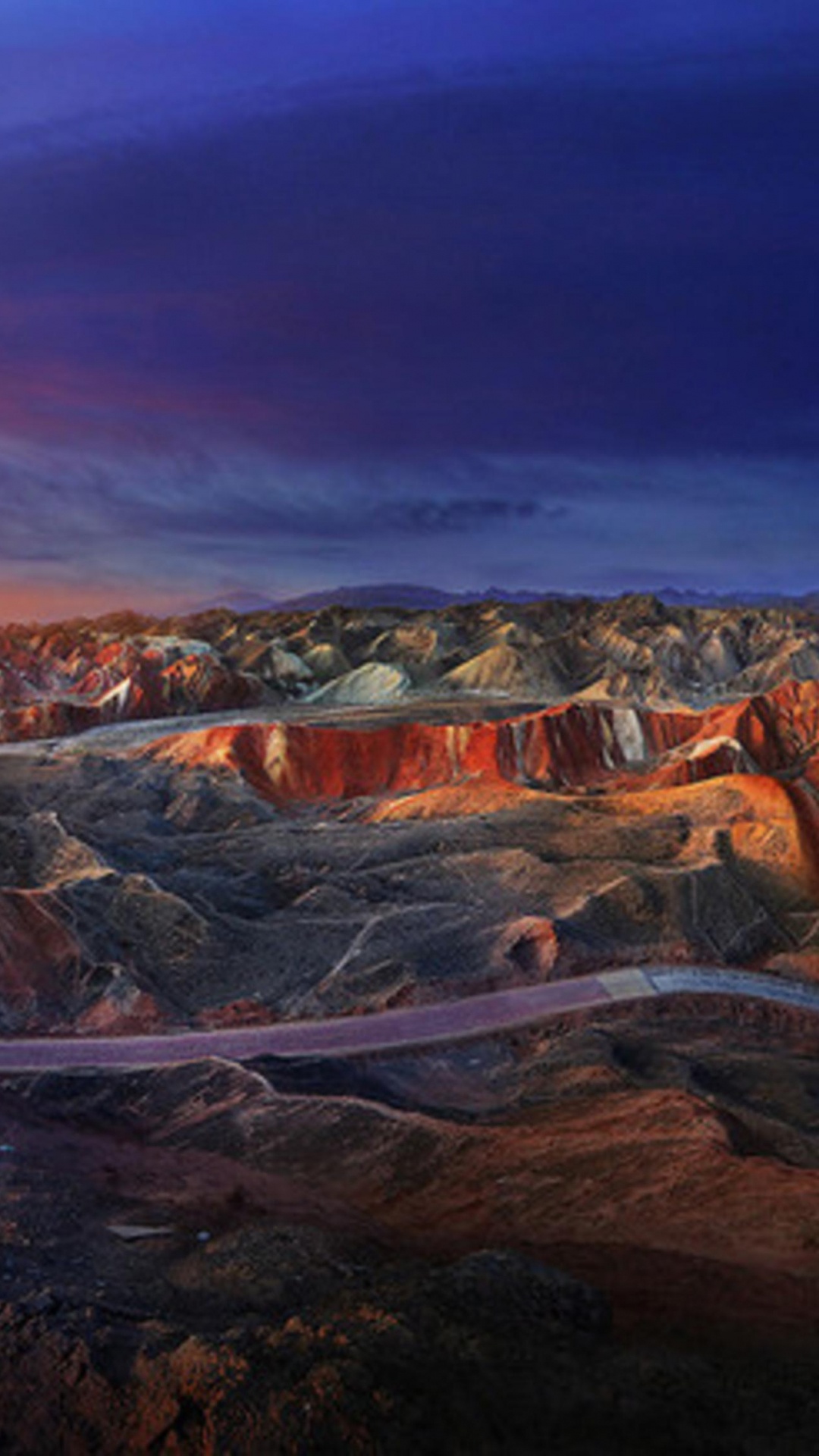 Woman in White Shirt and Blue Denim Jeans Standing on Brown Rock Formation During Daytime. Wallpaper in 1080x1920 Resolution