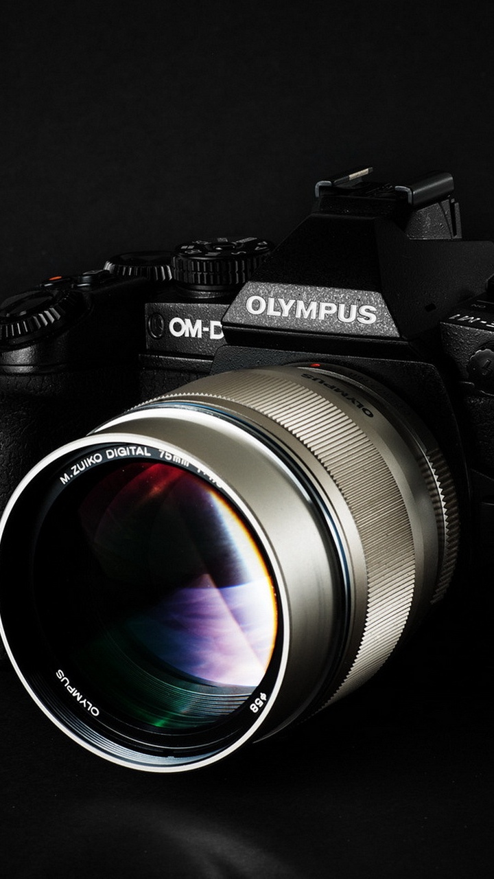 Schwarze Und Silberne Nikon Dslr Kamera. Wallpaper in 720x1280 Resolution