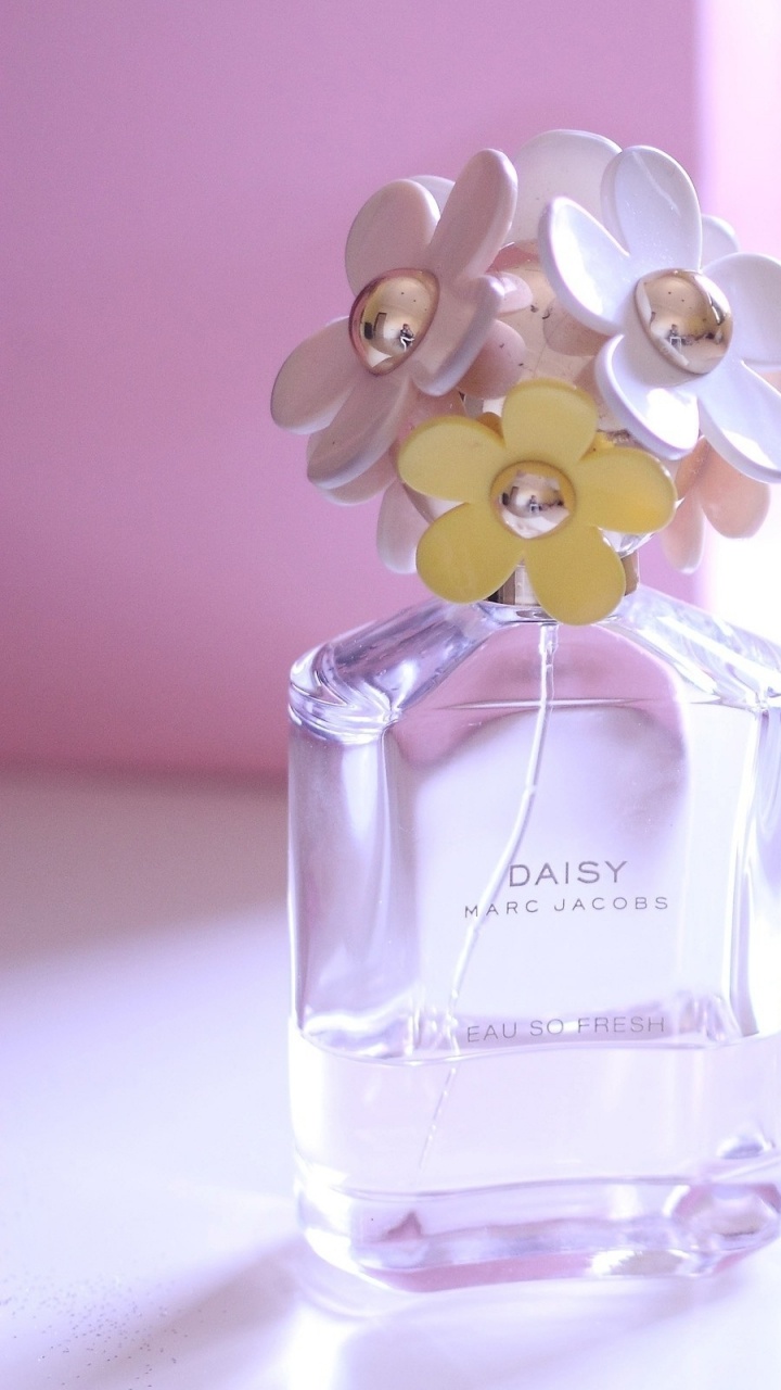 Clear Glass Perfume Bottle on White Table. Wallpaper in 720x1280 Resolution