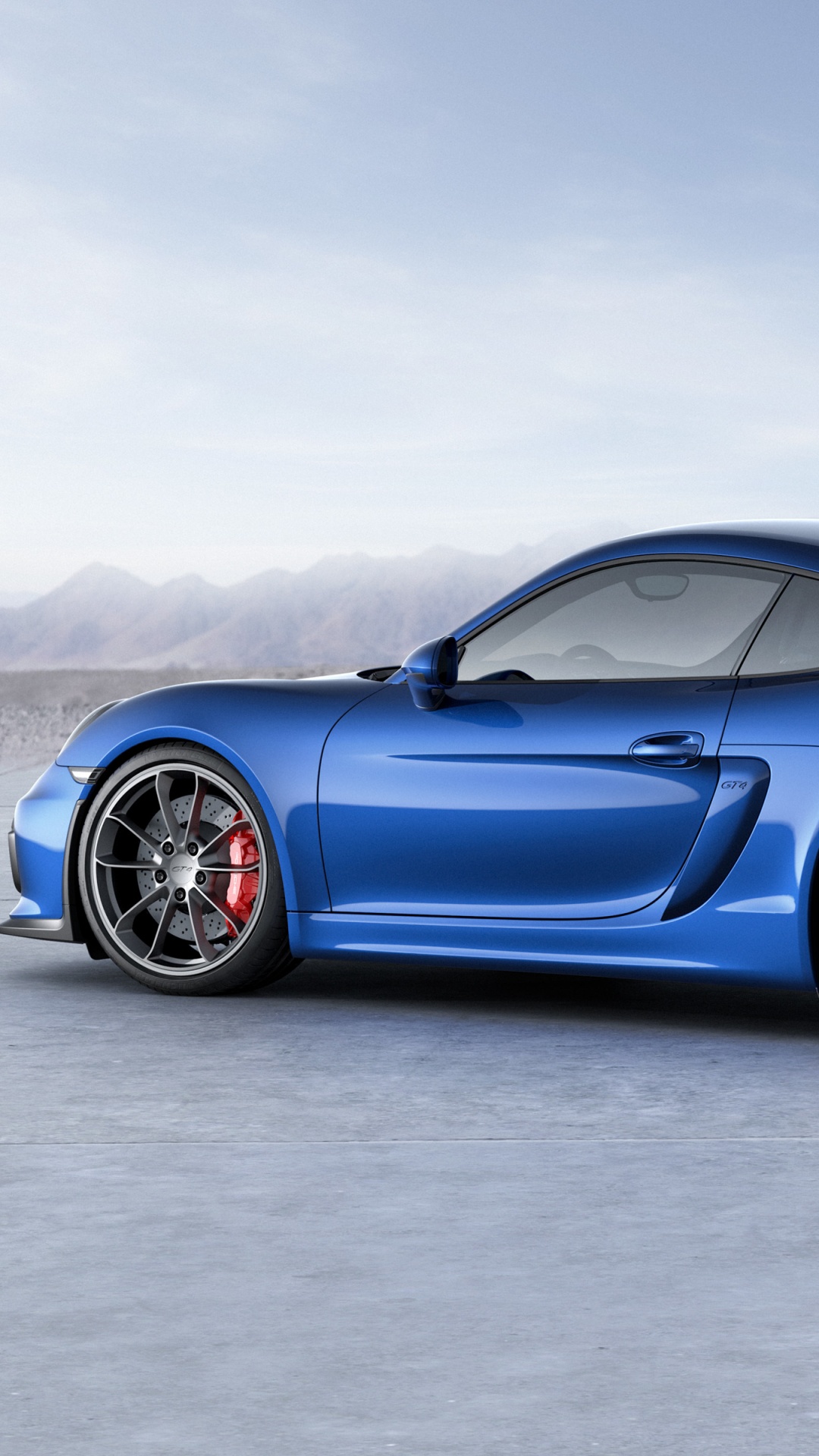 Blauer Porsche 911 Auf Grauem Betonpflaster. Wallpaper in 1080x1920 Resolution