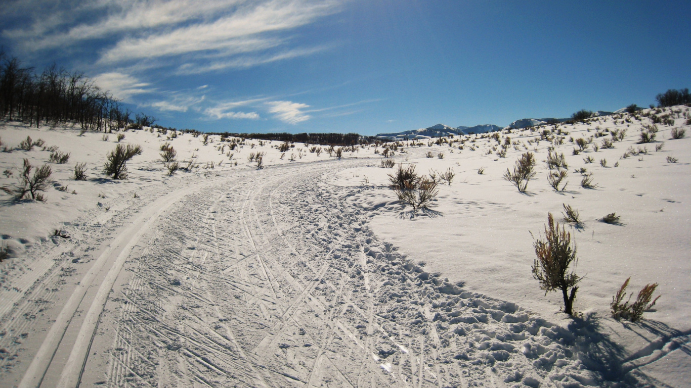 Snow Covered Field Under Blue Sky During Daytime. Wallpaper in 1366x768 Resolution