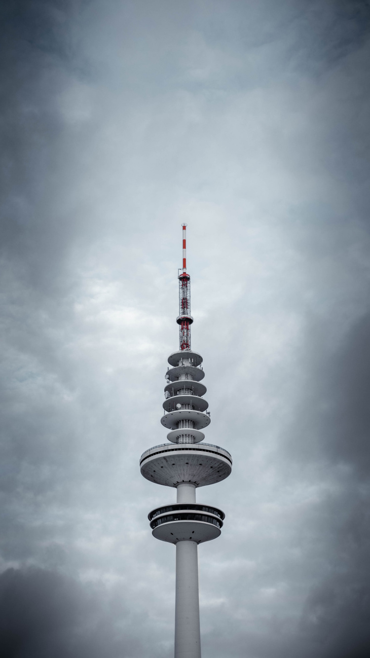 White and Black Tower Under Cloudy Sky. Wallpaper in 750x1334 Resolution