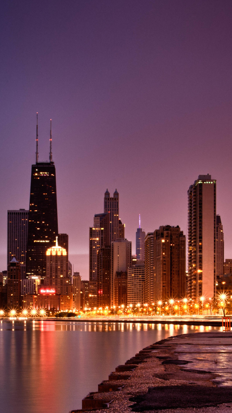 City Skyline During Night Time. Wallpaper in 750x1334 Resolution
