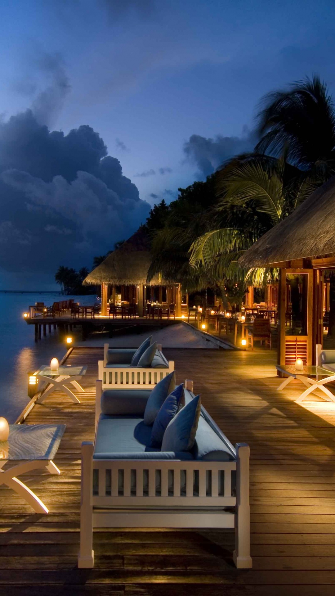 White and Brown Wooden House Near Body of Water During Daytime. Wallpaper in 1080x1920 Resolution