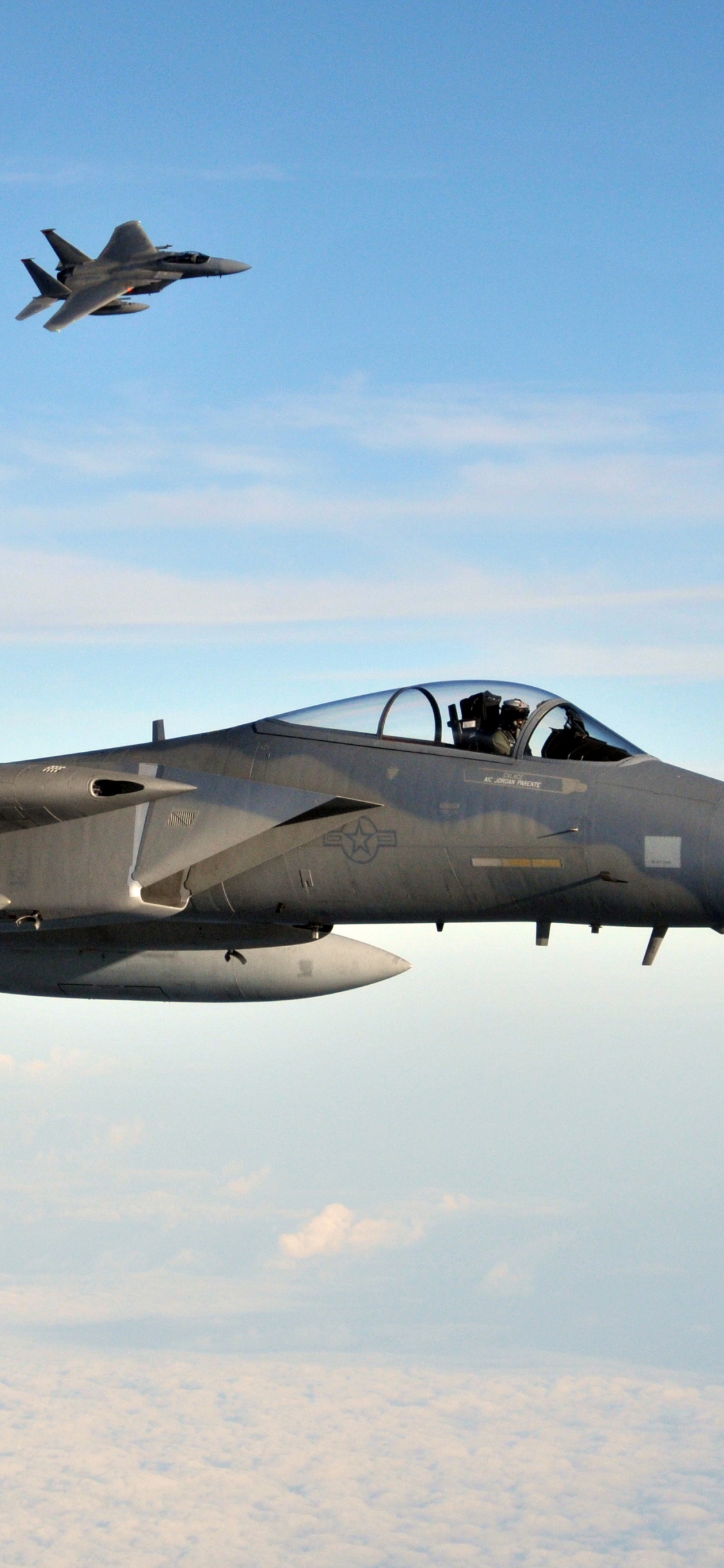 Black Fighter Plane in Mid Air During Daytime. Wallpaper in 1125x2436 Resolution