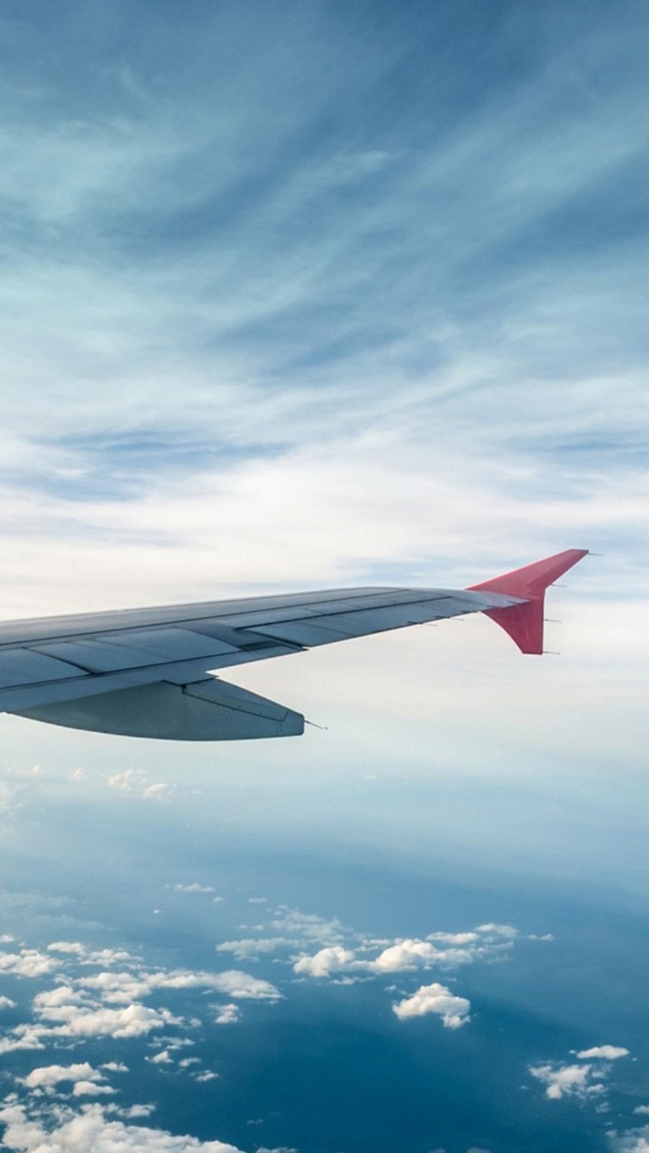 White and Red Airplane Wing Under Blue Sky and White Clouds During Daytime. Wallpaper in 720x1280 Resolution