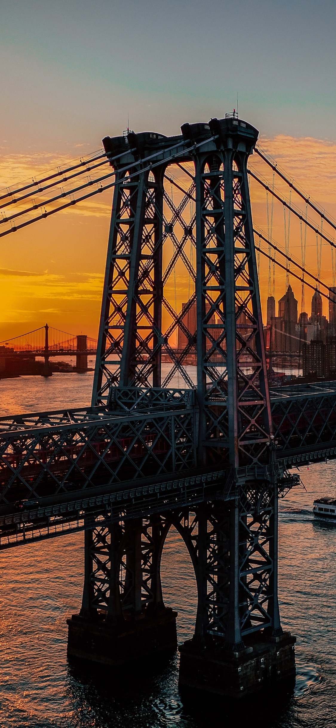 Bridge Over Water During Sunset. Wallpaper in 1125x2436 Resolution