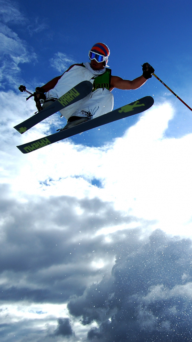 Person in Red Jacket and White Pants Riding on White and Red Snowboard During Daytime. Wallpaper in 750x1334 Resolution