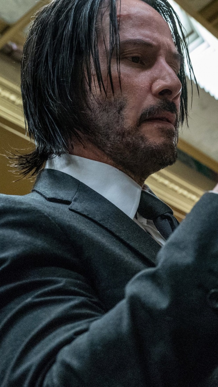 Man in Black Suit Holding White Paper. Wallpaper in 720x1280 Resolution