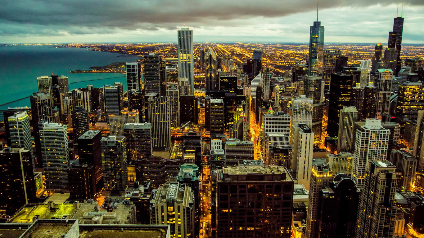 Aerial View of City Buildings During Night Time. Wallpaper in 1366x768 Resolution