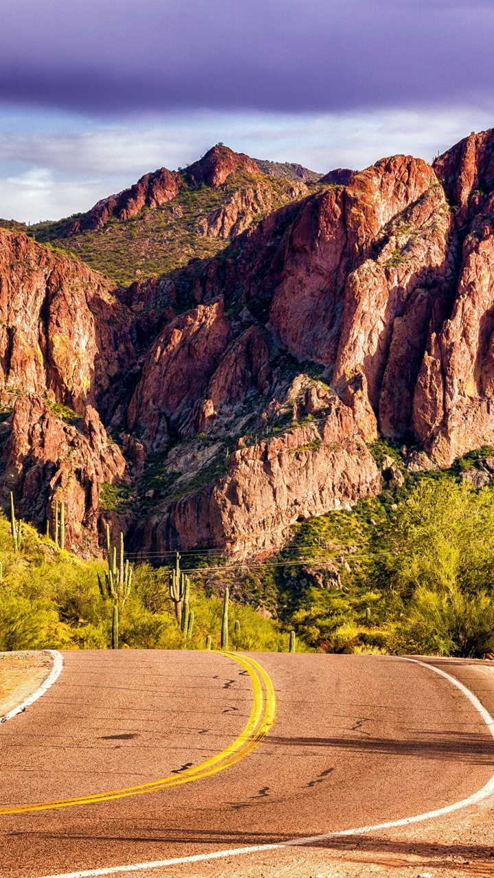 Gray Asphalt Road Near Brown Rock Mountain During Daytime. Wallpaper in 720x1280 Resolution