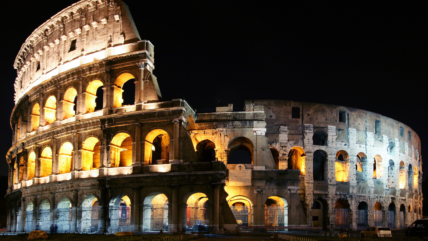 Brown Concrete Building During Night Time. Wallpaper in 1366x768 Resolution
