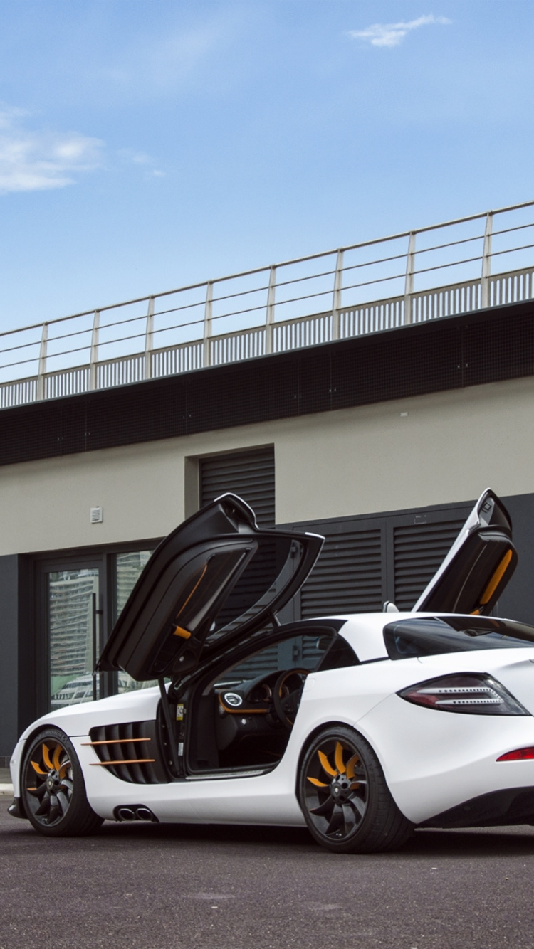 White and Black Porsche 911 Parked on Parking Lot. Wallpaper in 750x1334 Resolution