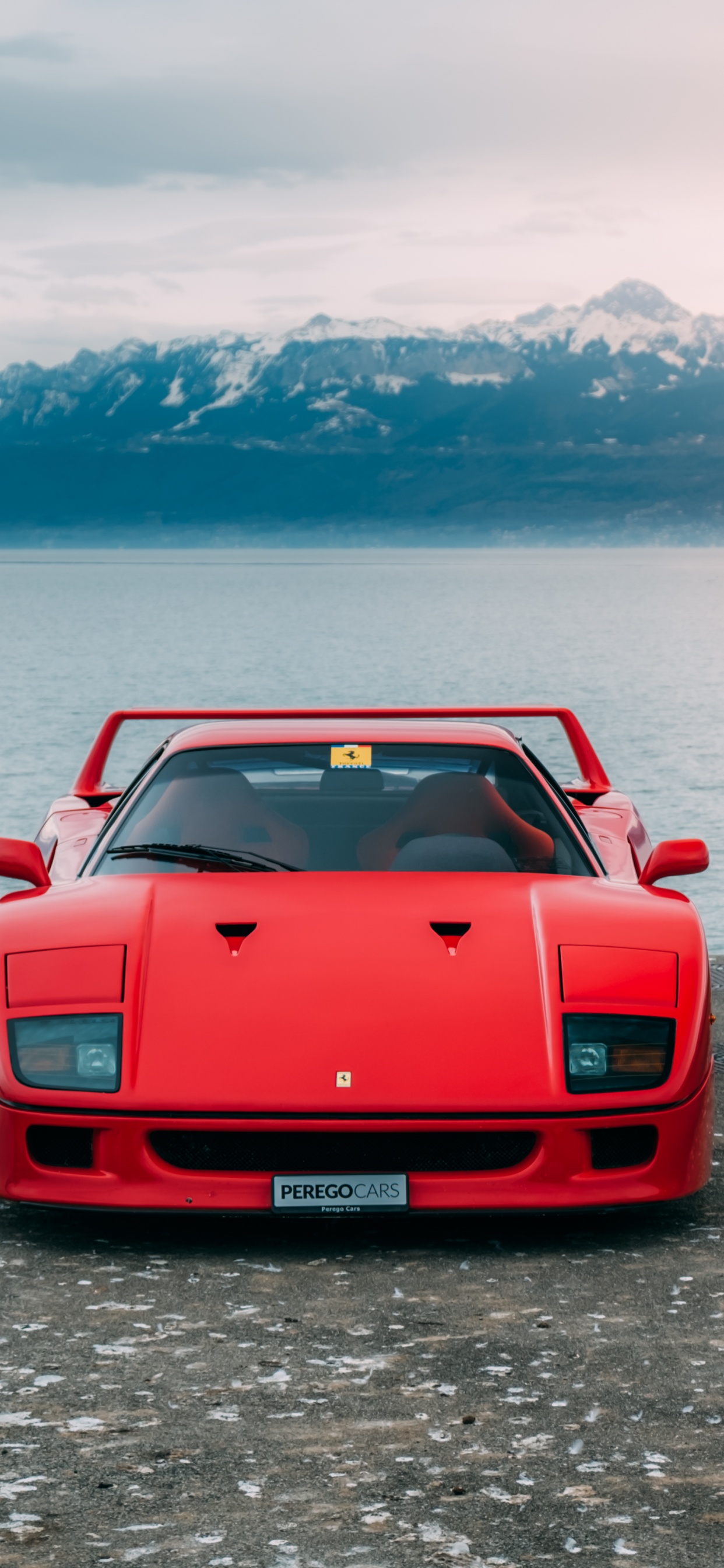 Red Chevrolet Camaro on Dock During Daytime. Wallpaper in 1242x2688 Resolution