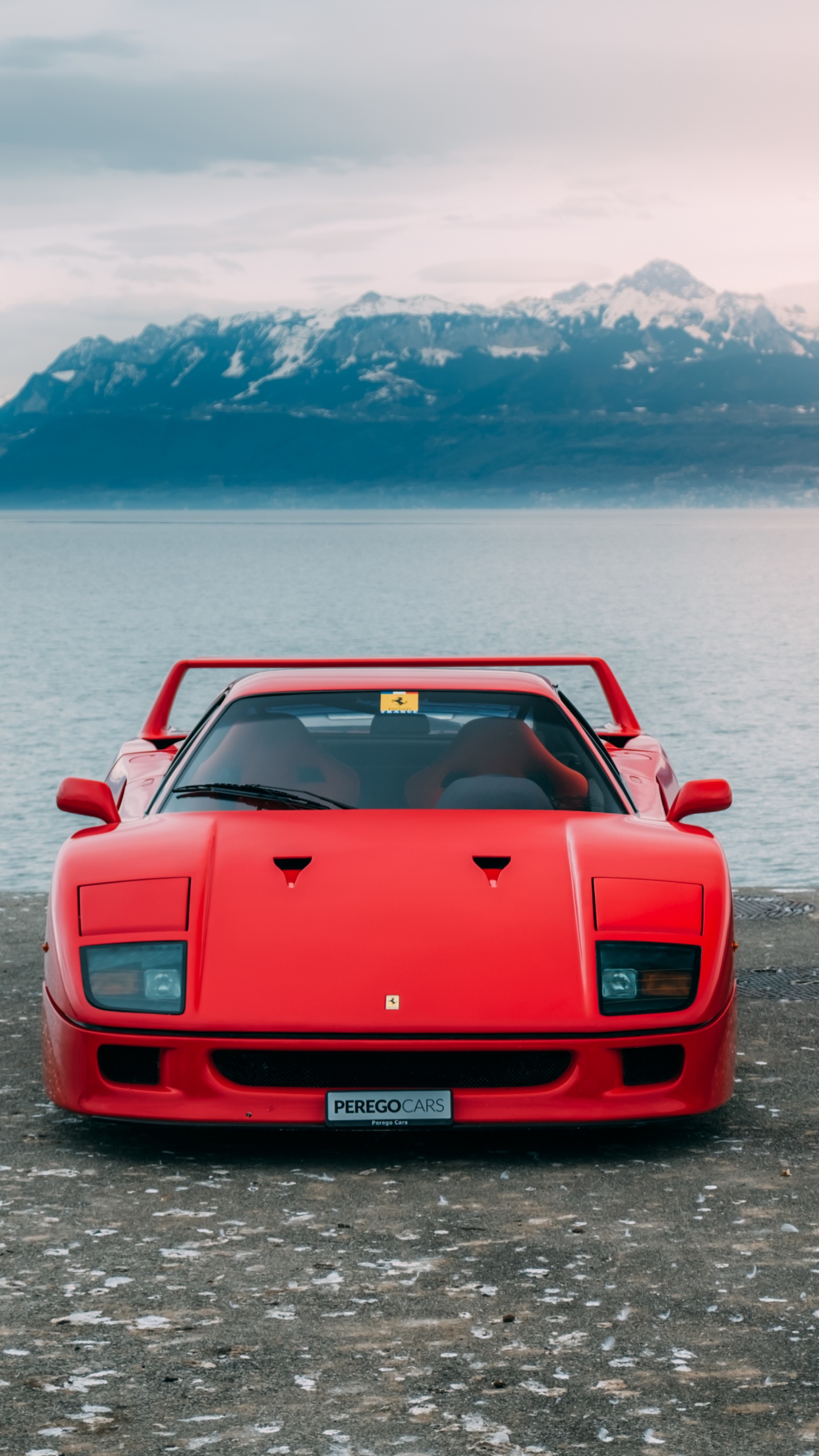 Red Chevrolet Camaro on Dock During Daytime. Wallpaper in 1440x2560 Resolution