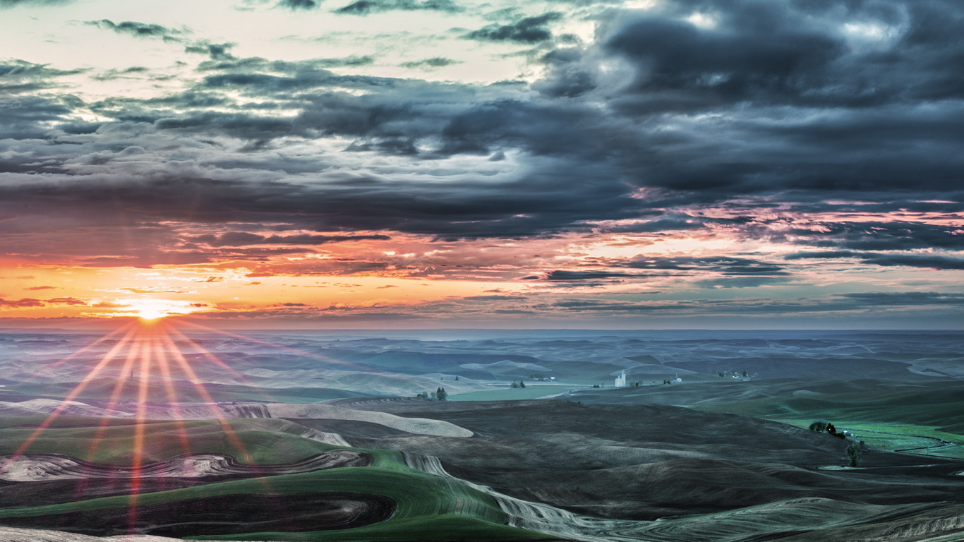 Green Grass Field Near Sea Under Cloudy Sky During Sunset. Wallpaper in 1366x768 Resolution