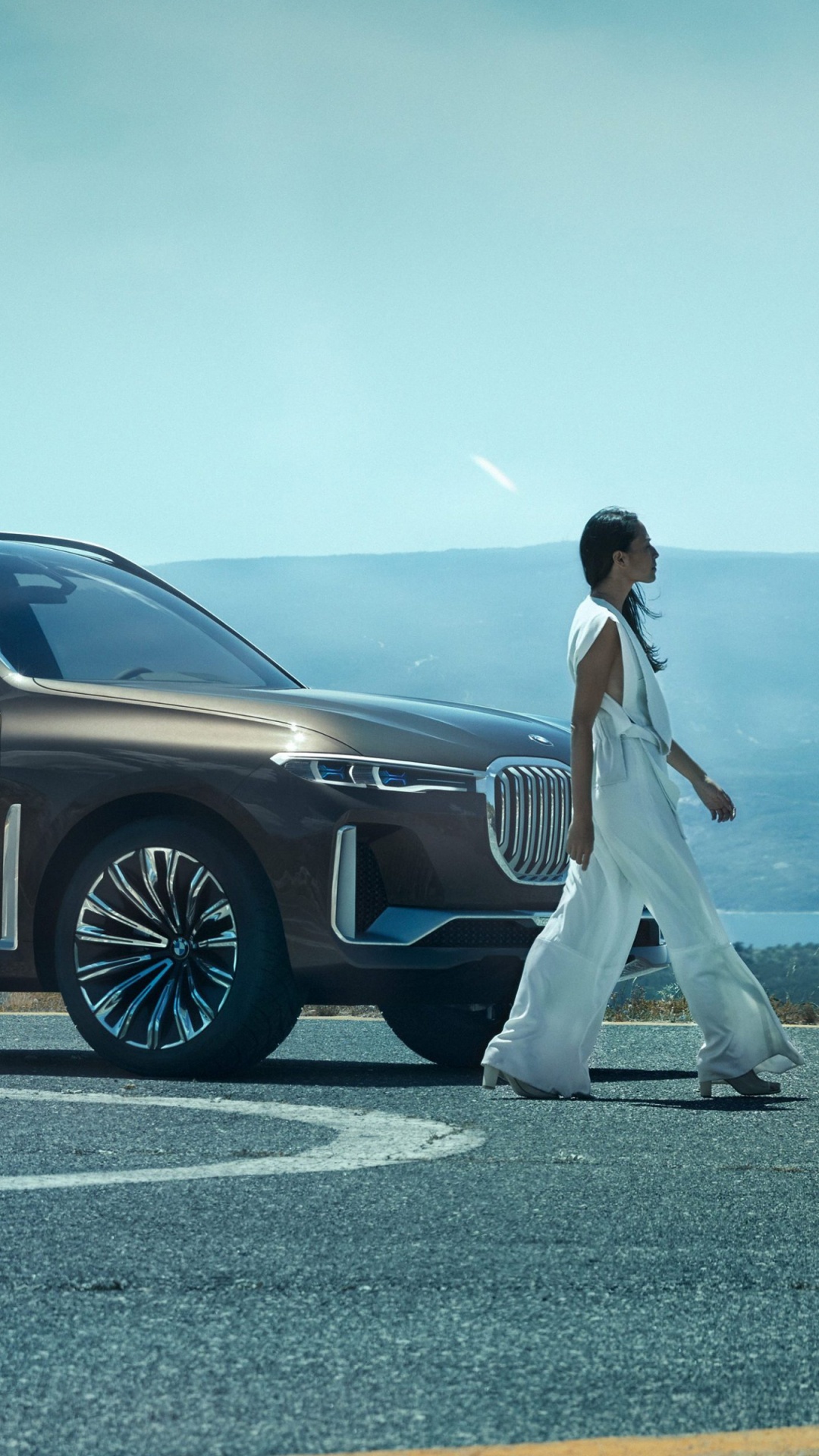Man in White T-shirt and White Pants Standing Beside Black Suv During Daytime. Wallpaper in 1080x1920 Resolution