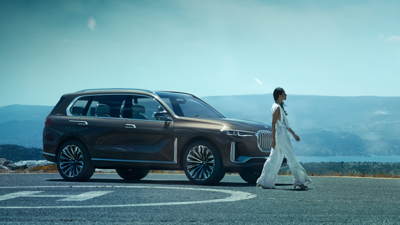 Man in White T-shirt and White Pants Standing Beside Black Suv During Daytime. Wallpaper in 1366x768 Resolution