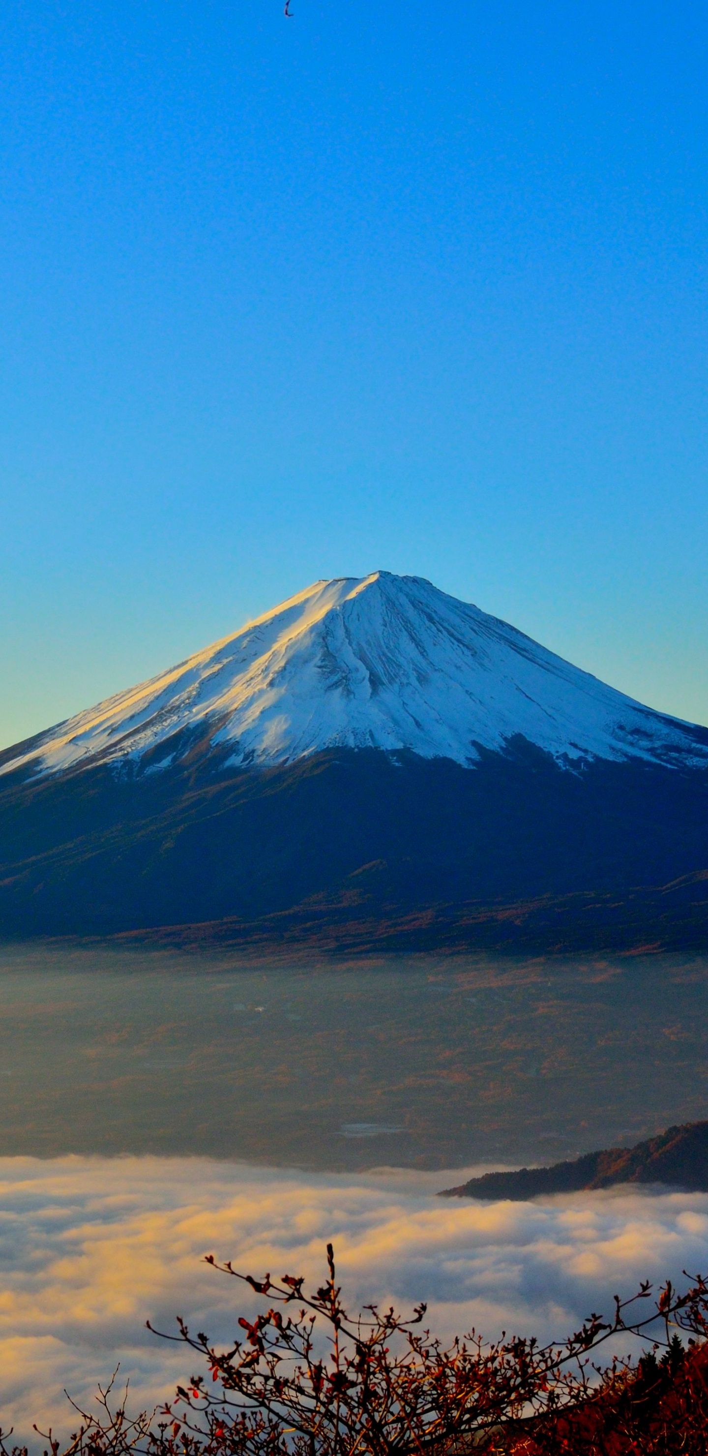 Snow Covered Mountain Under Blue Sky During Daytime. Wallpaper in 1440x2960 Resolution