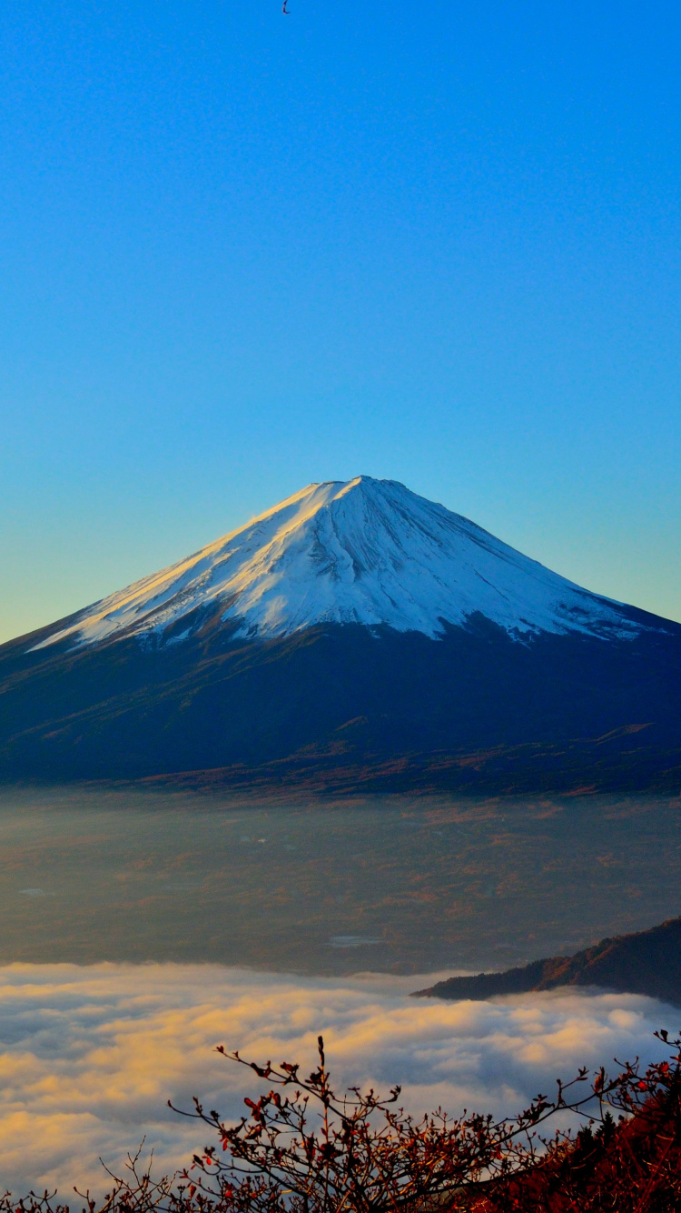 Snow Covered Mountain Under Blue Sky During Daytime. Wallpaper in 750x1334 Resolution