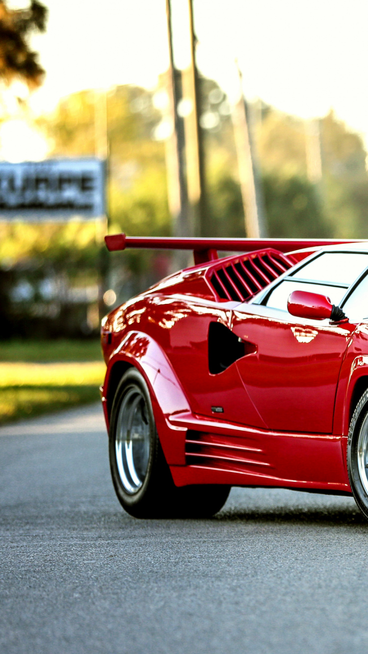 Roter Porsche 911 Tagsüber Unterwegs. Wallpaper in 750x1334 Resolution