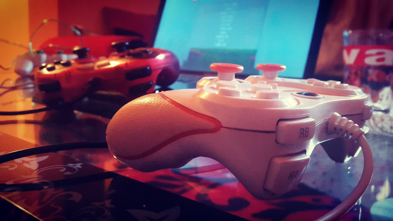 White Game Controller on Brown Wooden Table. Wallpaper in 1366x768 Resolution