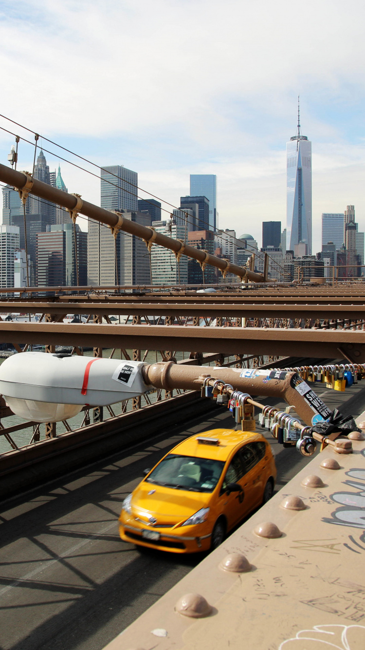 Yellow Taxi on Bridge During Daytime. Wallpaper in 750x1334 Resolution