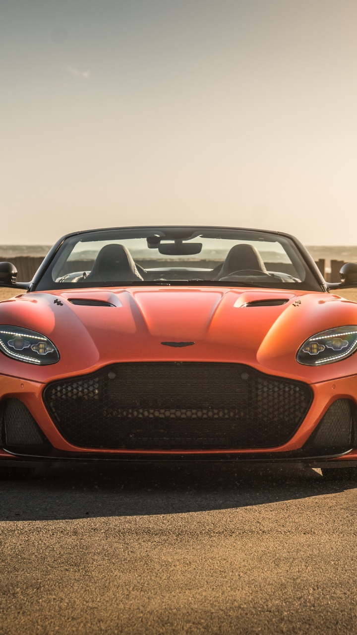 Orange Porsche 911 Auf Braunem Feldweg Tagsüber During. Wallpaper in 720x1280 Resolution